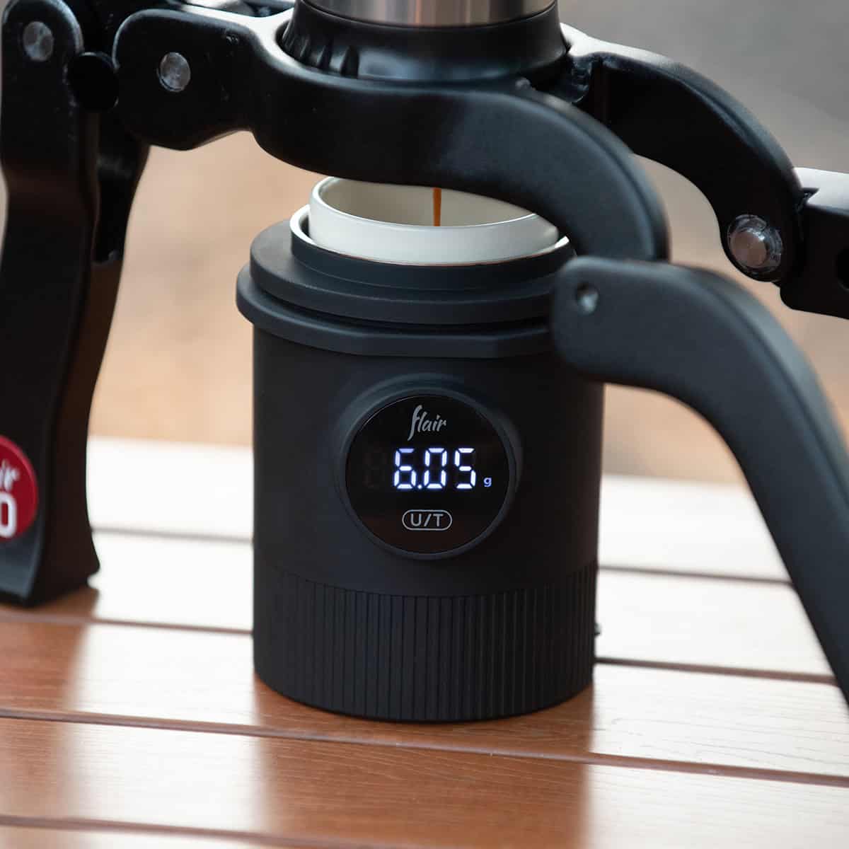 Flair weigh cup measuring an espresso extraction from the Flair 2GO