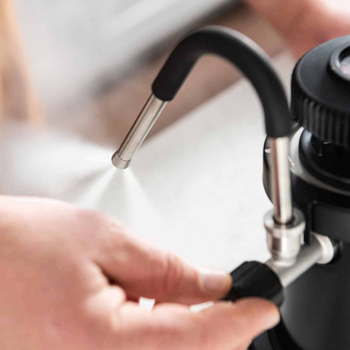 Close up image of the cool touch wand of the Flair eWizard Milk Steamer.