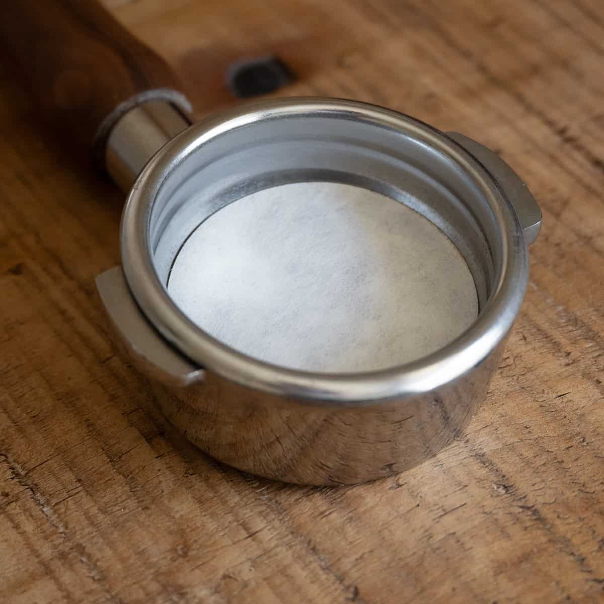Paper filter inside the portafilter basket of the Flair 58 Plus 2
