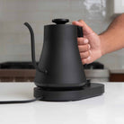 Flair digital gooseneck kettle on a white counter.