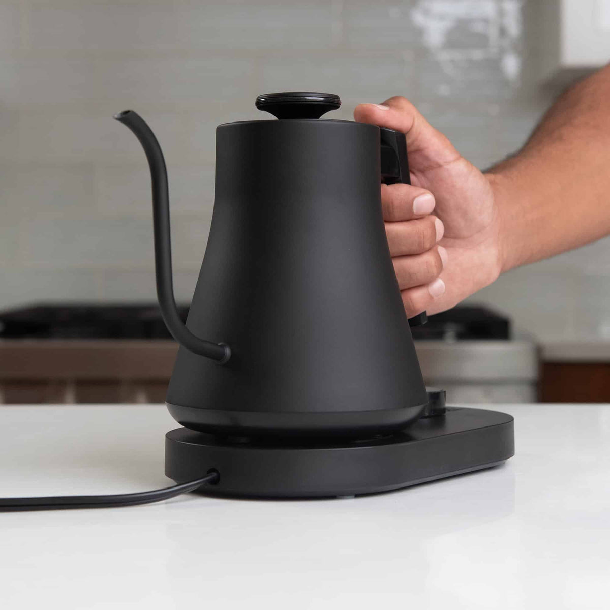 Flair digital gooseneck kettle on a white counter.