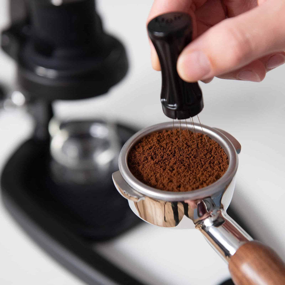 Flair WDT Tool in use with coffee grounds