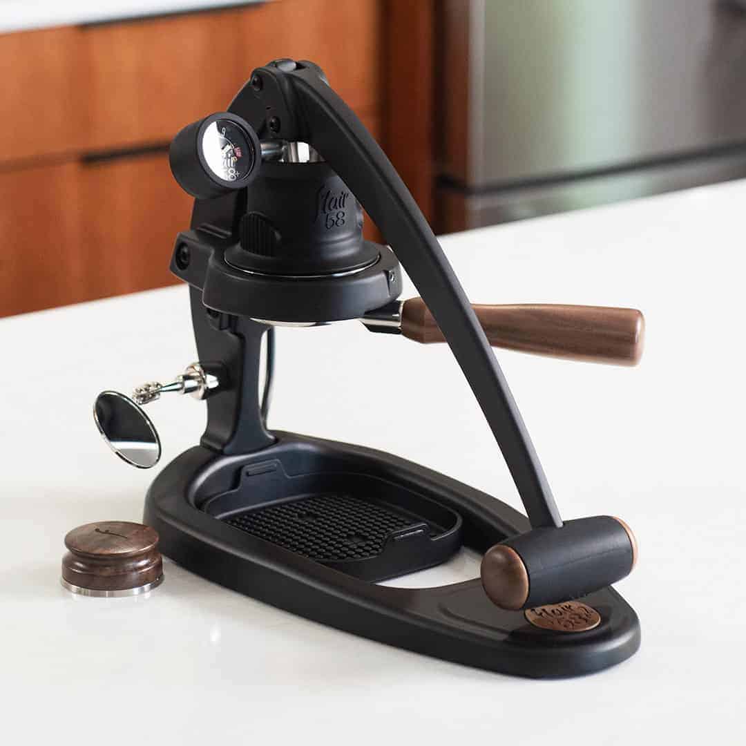 Flair 58 Plus 2 manual espresso maker on a white counter.