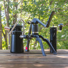 An outdoor photo of the Steam Travel Kit showing the Flair 2GO, Wizard steamer and Royal grinder.