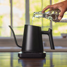 Adding water into the top of the Flair Kettle before boiling