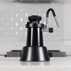 Flair eWizard electric milk steamer on a counter in a white kitchen.