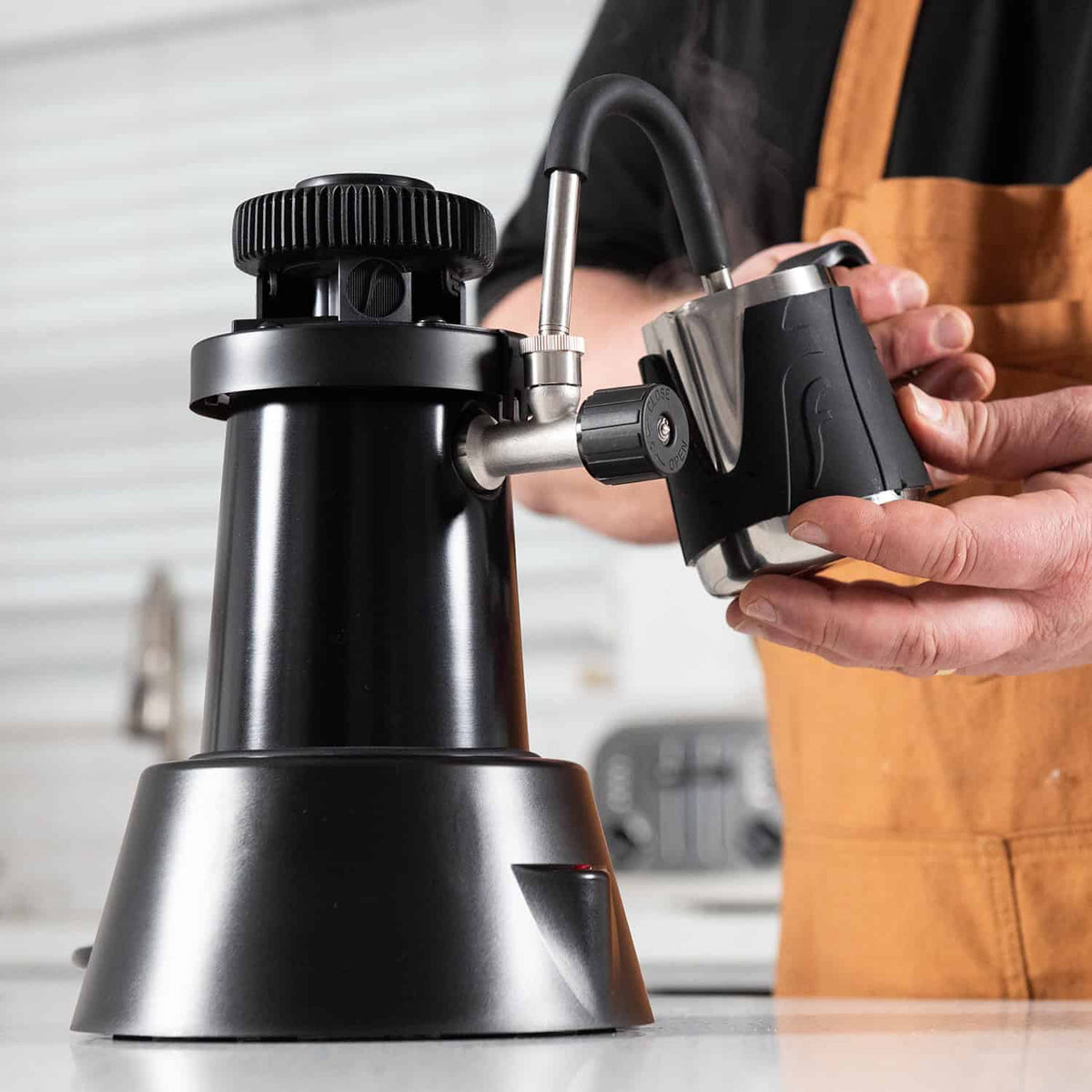 Flair eWizard electric milk steamer being used with the Flair Milk Pitcher.
