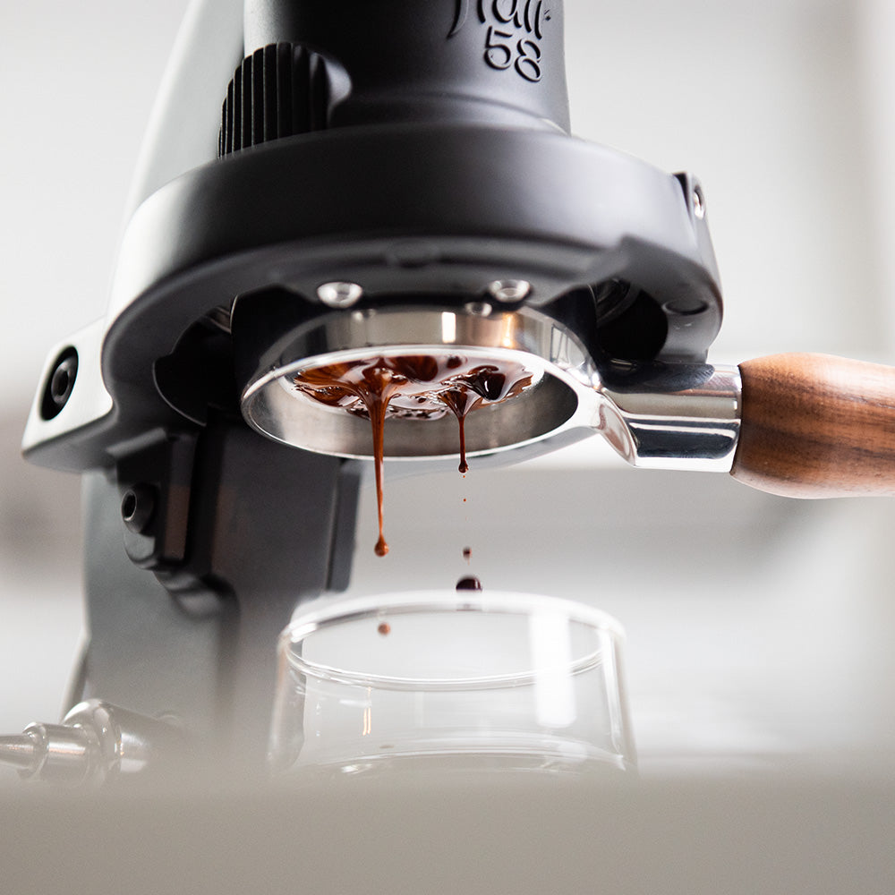 Close-up of the Flair 58 Plus 2 brewing espresso.