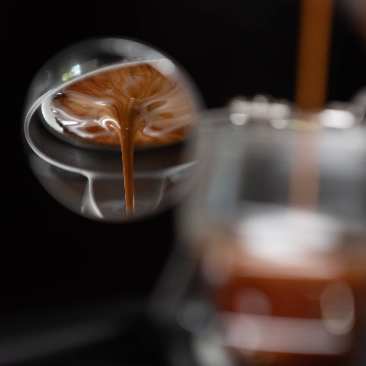 Close up of an espresso extraction from the Flair 58 Plus 2 manual espresso maker