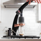 Flair PRO 3 Black in a white kitchen brewing espresso.